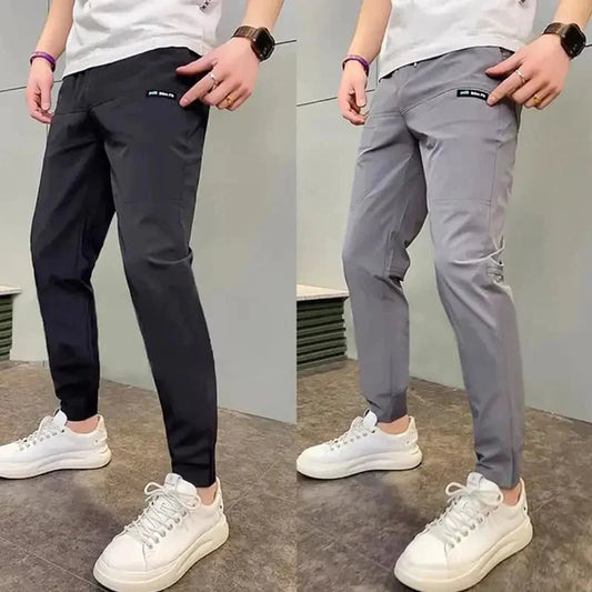 Herenjoggingbroek slim fit stretch taps toelopend licht met zakken